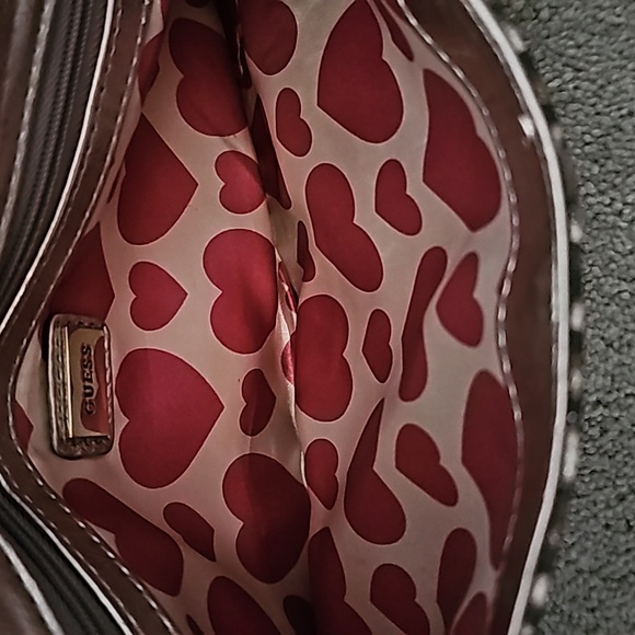 GUESS clutch bag. Animal print w/hearts on inside lining. - Picture 6 of 8